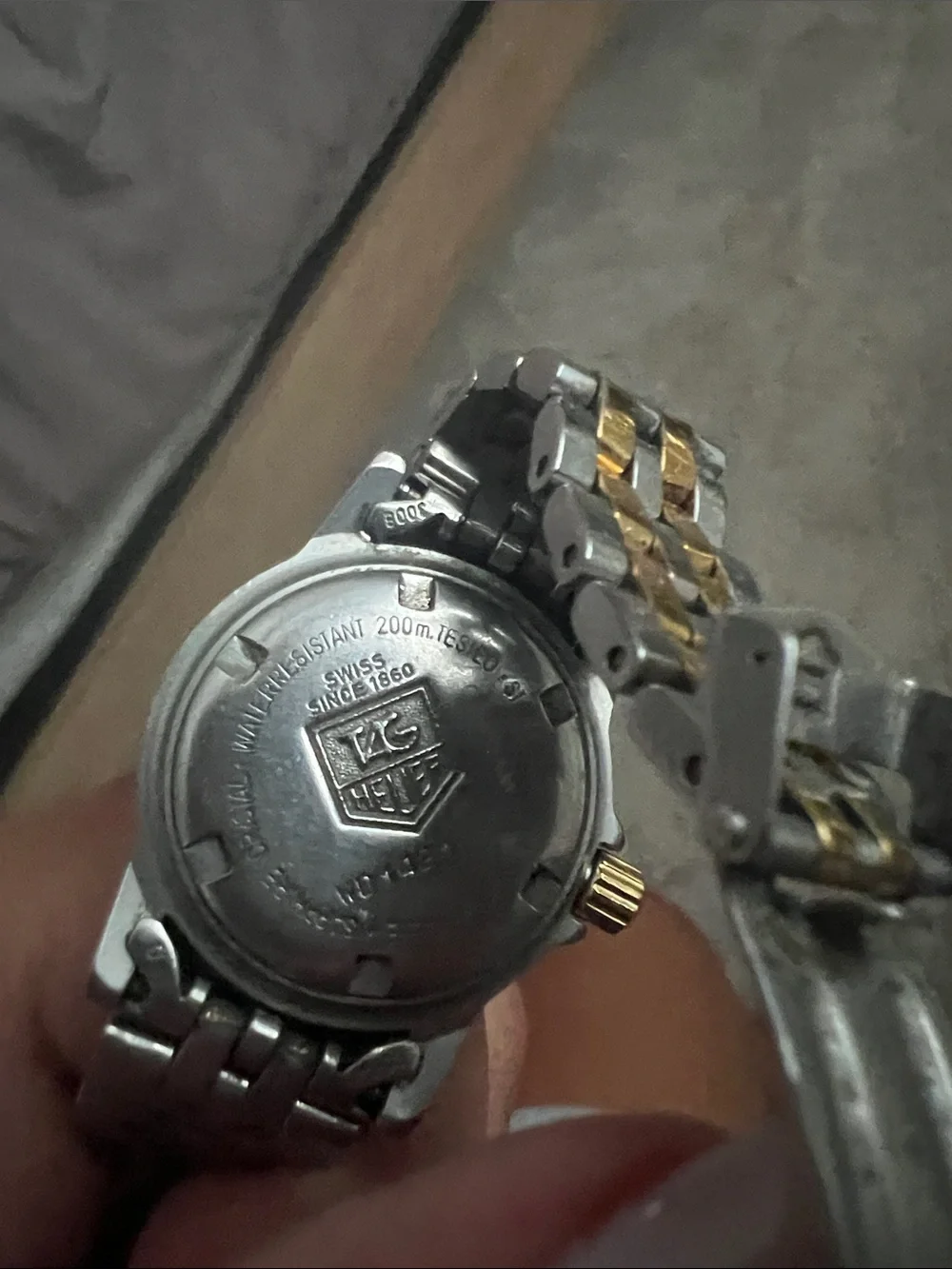 Tag Heuer Two-Tone Silver and Gold Stainless Steel Watch with White Dial.